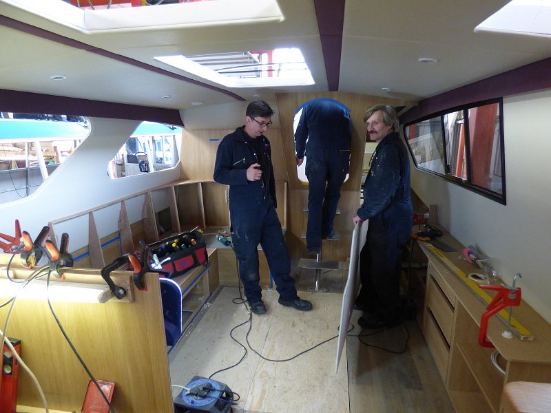 men working on the interior of fair entrepreneur