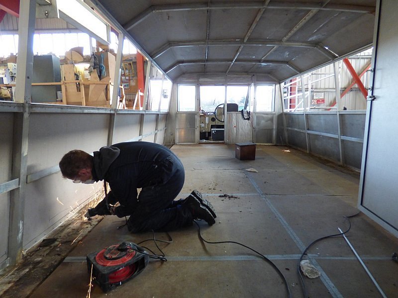 internal progress shot of works onboard queen of the broads with man using power tools