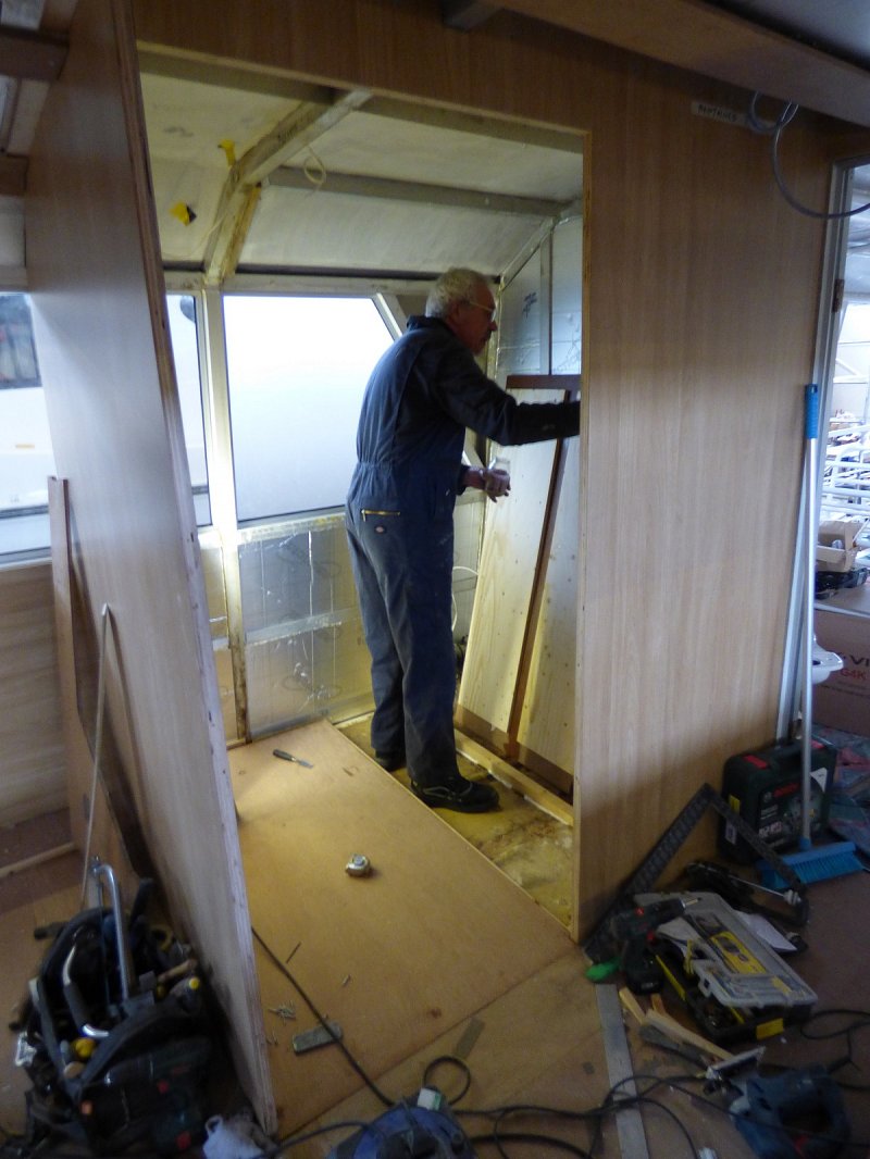 man working on internal toilet area of queen of the broads